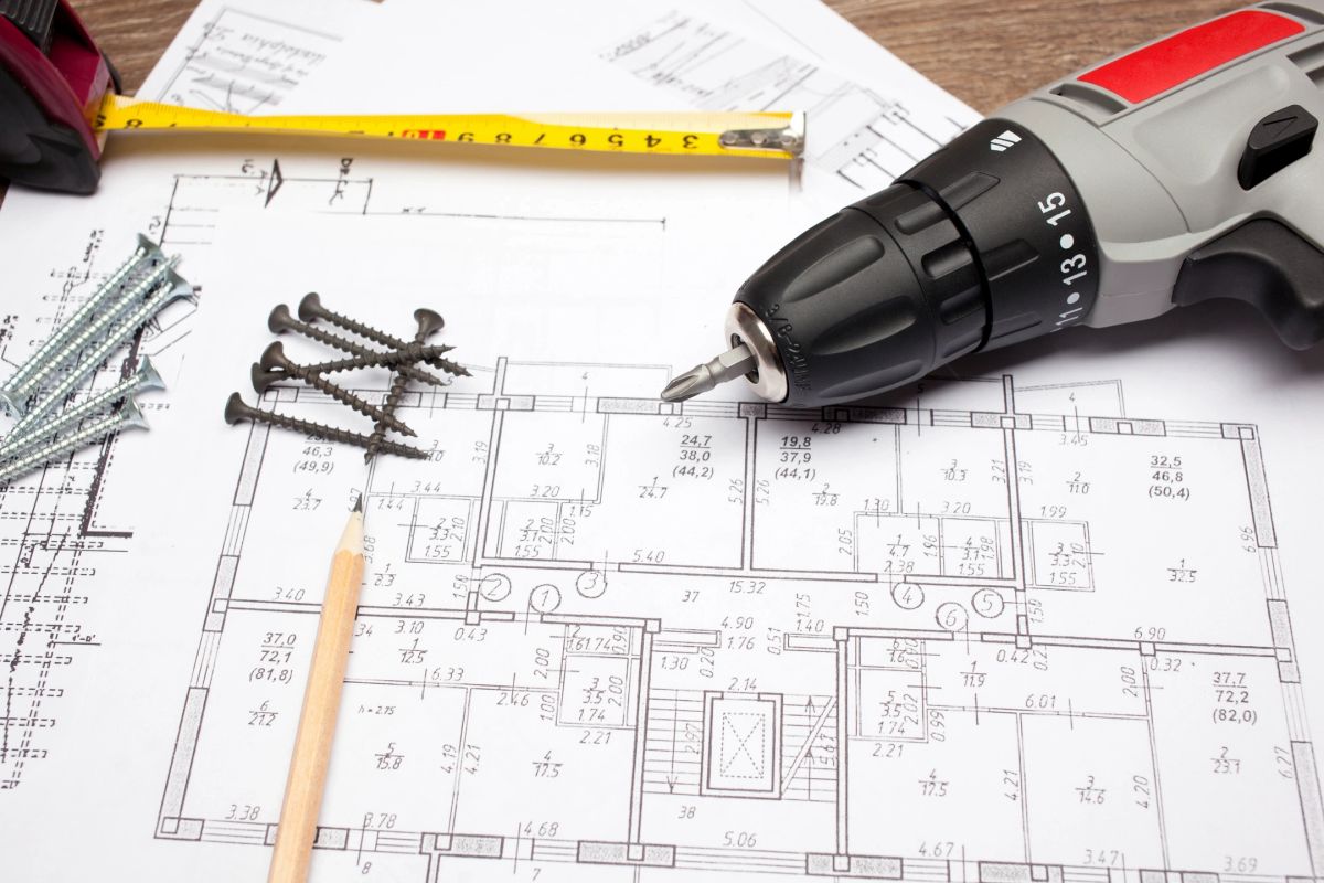 Construction drawings, measuring tape, and tools